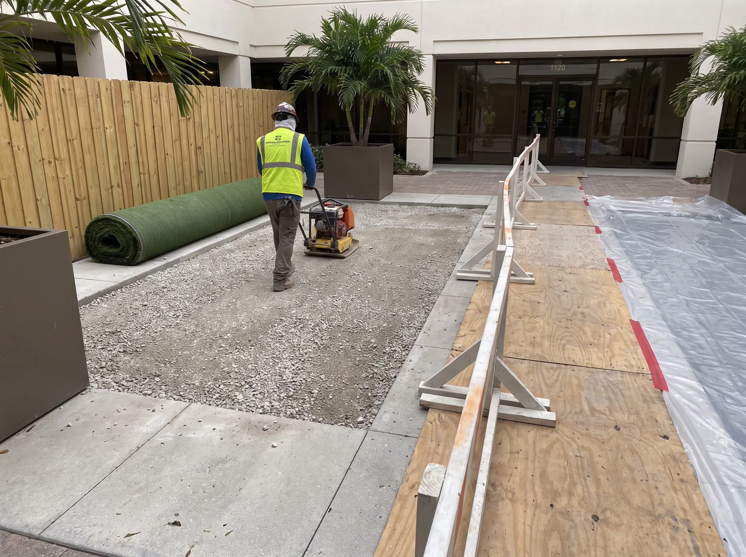 Commercial turf base preparation with protected pedestrian access.